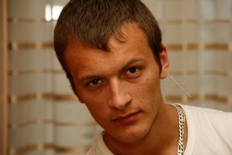 Big-dicked and older-looking twink gets naked