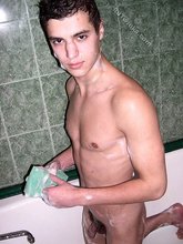 Young twink showering after he came hard on camera