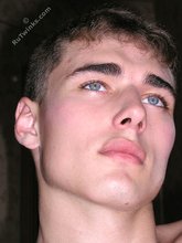 Blue-eyed brunette twink furiously dry-humping the wall