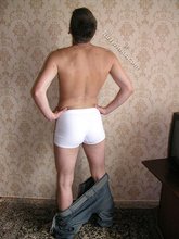 Blue-eyed twink takes off his jeans and grabs his own ass
