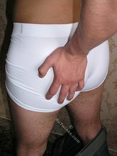 Blue-eyed twink takes off his jeans and grabs his own ass