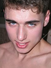 Blue-eyed twink takes off his jeans and grabs his own ass