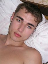 Blue-eyed young boy with a hairy ass strokes his cock