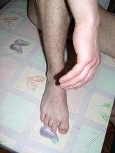 Dark-haired twink stroking his cock, alone at night
