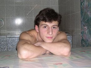 Dark-haired twink stroking his cock, alone at night