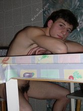 Dark-haired twink stroking his cock, alone at night