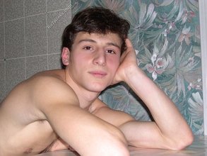 Dark-haired twink stroking his cock, alone at night