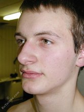 Jacked-up twink with a curved cock does gymnastics