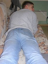 Twink hugs a wall and takes off his shirt