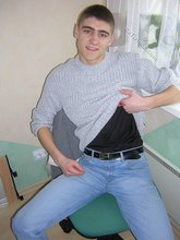 Twink hugs a wall and takes off his shirt