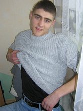 Twink hugs a wall and takes off his shirt