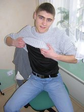 Twink hugs a wall and takes off his shirt