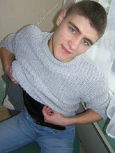 Twink hugs a wall and takes off his shirt