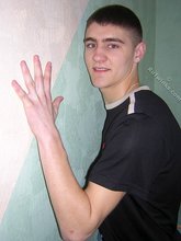 Twink hugs a wall and takes off his shirt