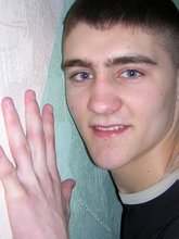 Twink hugs a wall and takes off his shirt