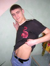 Twink hugs a wall and takes off his shirt