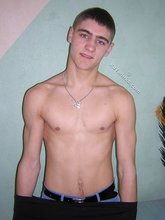 Twink hugs a wall and takes off his shirt