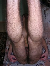 Dark-haired dude shows his alluring anal hole and feet