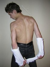 Twisted twink brunette shows off his six pack