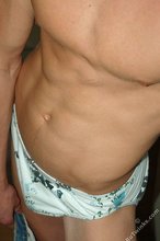 Cheerful gay boy shows off his soft soles to the viewer