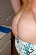 Cheerful gay boy shows off his soft soles to the viewer