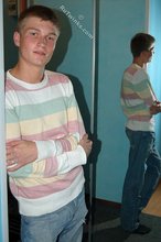 Blue-eyed blonde beauty takes off his striped shirt