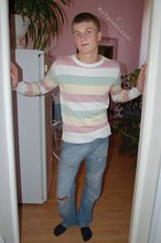 Blue-eyed blonde beauty takes off his striped shirt