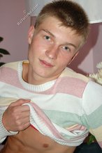 Blue-eyed blonde beauty takes off his striped shirt