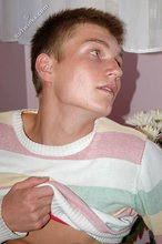 Blue-eyed blonde beauty takes off his striped shirt