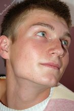 Blue-eyed blonde beauty takes off his striped shirt