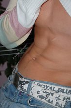 Blue-eyed blonde beauty takes off his striped shirt