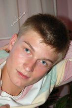 Blue-eyed blonde beauty takes off his striped shirt