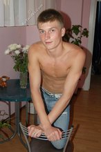 Blue-eyed blonde beauty takes off his striped shirt