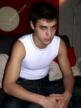 Ethnic twink takes off his tight jeans in the dark