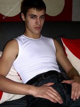 Ethnic twink takes off his tight jeans in the dark