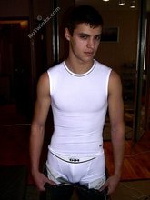 Ethnic twink takes off his tight jeans in the dark