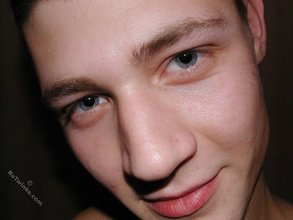 Blue-eyed twink shows his tattoos and hairy armpits