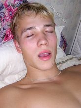 Twink with sexy feet masturbating all alone on a bed