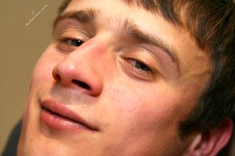 Cheerful twink showing his asshole from down below