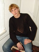 Redheaded hottie taking off his baggy sweater