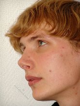Redheaded hottie taking off his baggy sweater