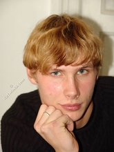 Redheaded hottie taking off his baggy sweater
