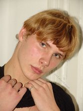 Redheaded hottie taking off his baggy sweater