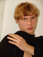 Redheaded hottie taking off his baggy sweater