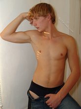 Blue-eyed redhead strips down to his sexy undies