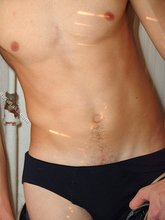 Blue-eyed redhead strips down to his sexy undies