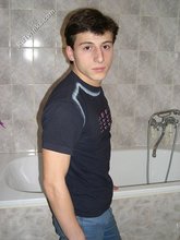 Dark-haired twink takes off his underwear in the bathroom