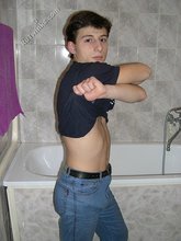 Dark-haired twink takes off his underwear in the bathroom