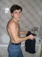 Dark-haired twink takes off his underwear in the bathroom