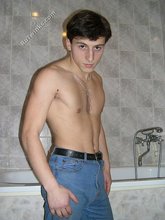 Dark-haired twink takes off his underwear in the bathroom